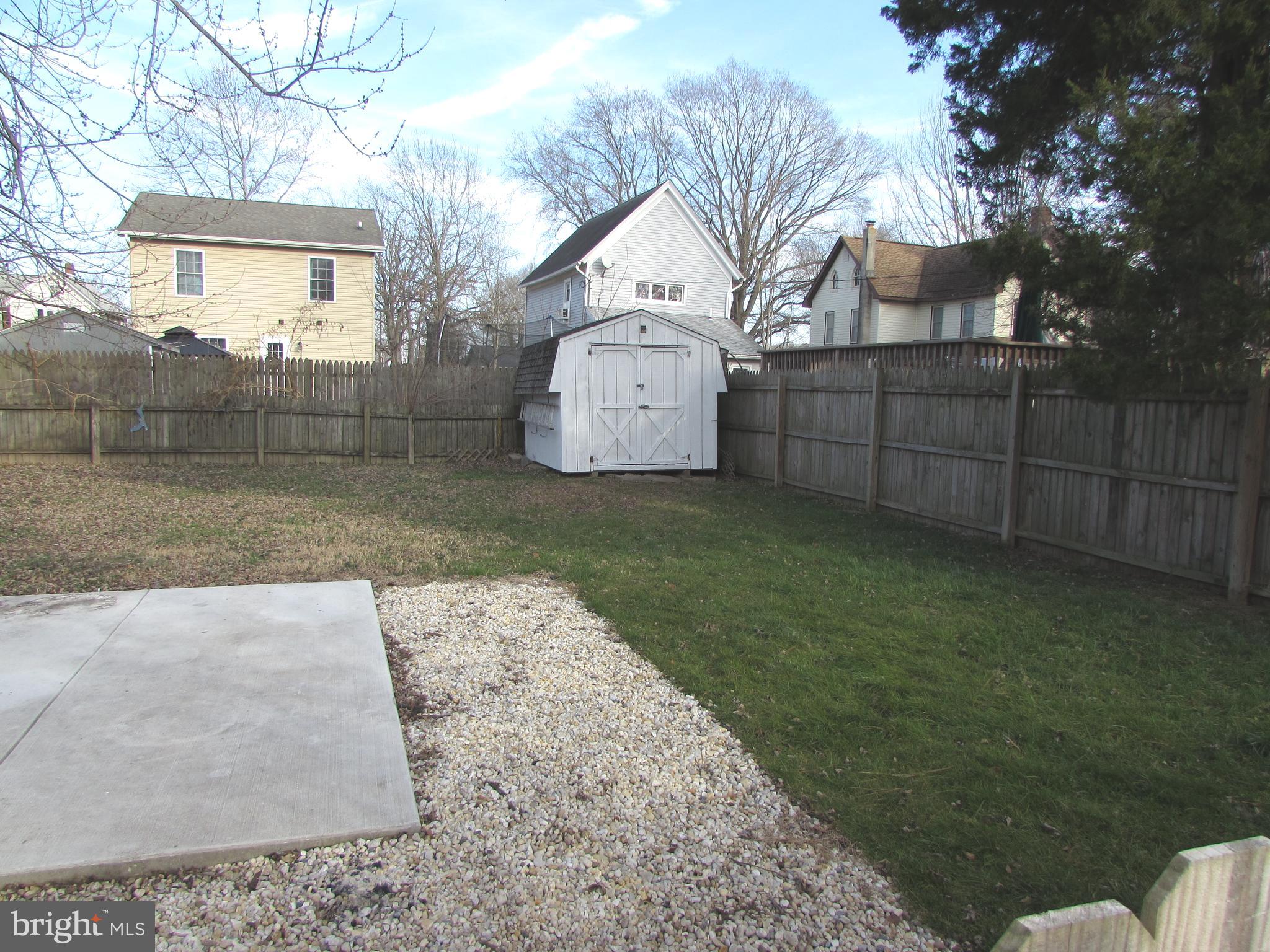 305 Maple Avenue Ridgely, MD 21660 - Photo 4 of 7 a front view of a house with a yard and garage