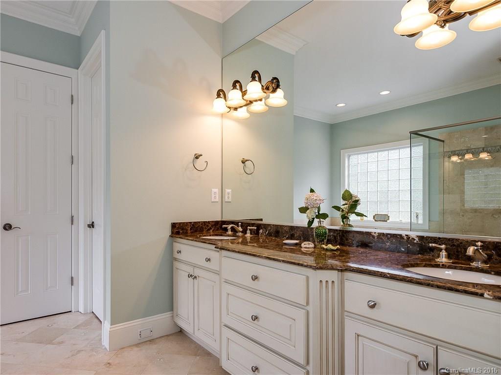 2419 Overhill Road Charlotte, NC 28211 - Photo 13 of 24 a bathroom with a sink mirror and double