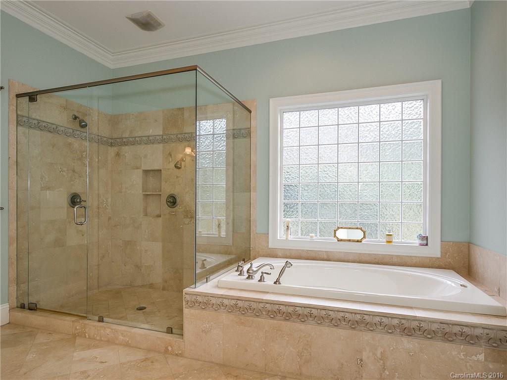 2419 Overhill Road Charlotte, NC 28211 - Photo 14 of 24 a bathroom with a bathtub and a shower