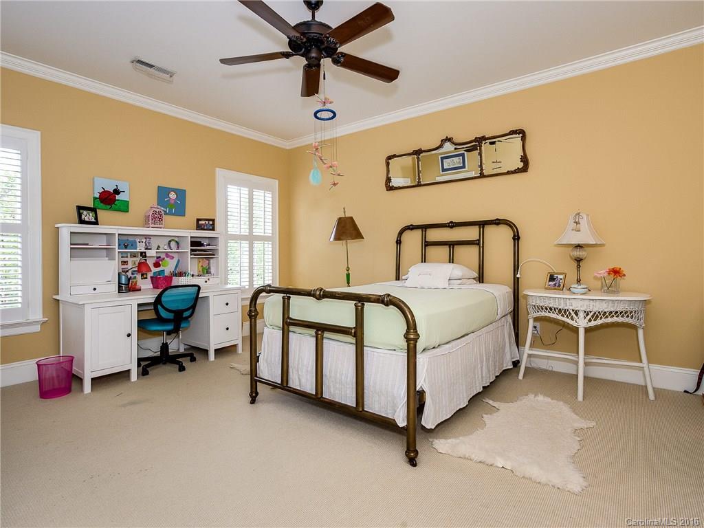 2419 Overhill Road Charlotte, NC 28211 - Photo 16 of 24 a bedroom with a bed and a table