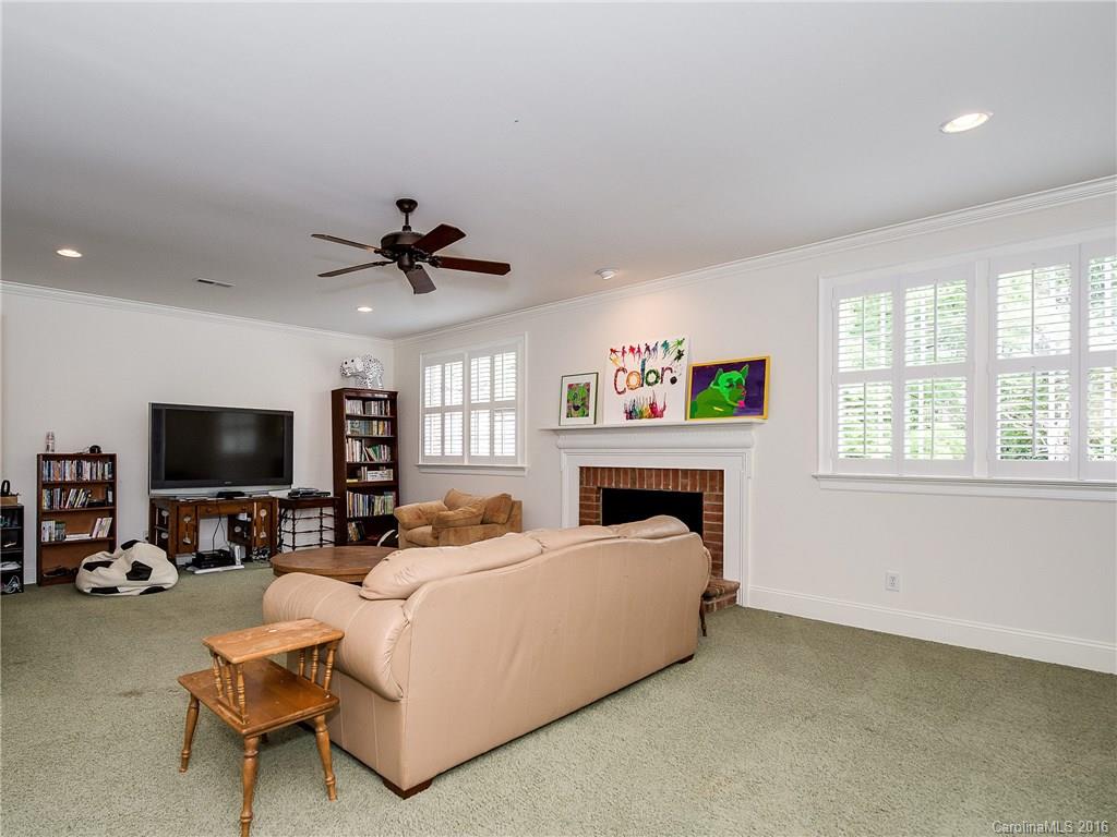 2419 Overhill Road Charlotte, NC 28211 - Photo 19 of 24 a living room with furniture and a flat screen tv