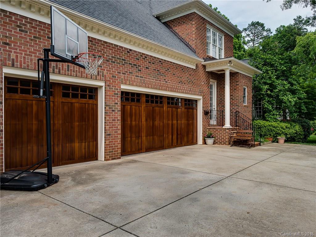 2419 Overhill Road Charlotte, NC 28211 - Photo 24 of 24 a front view of a house with a yard and garage