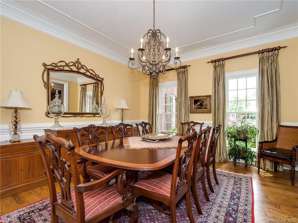 2419 Overhill Road Charlotte, NC 28211 - Photo 5 of 24 a view of a dining room with furniture and a chandelier