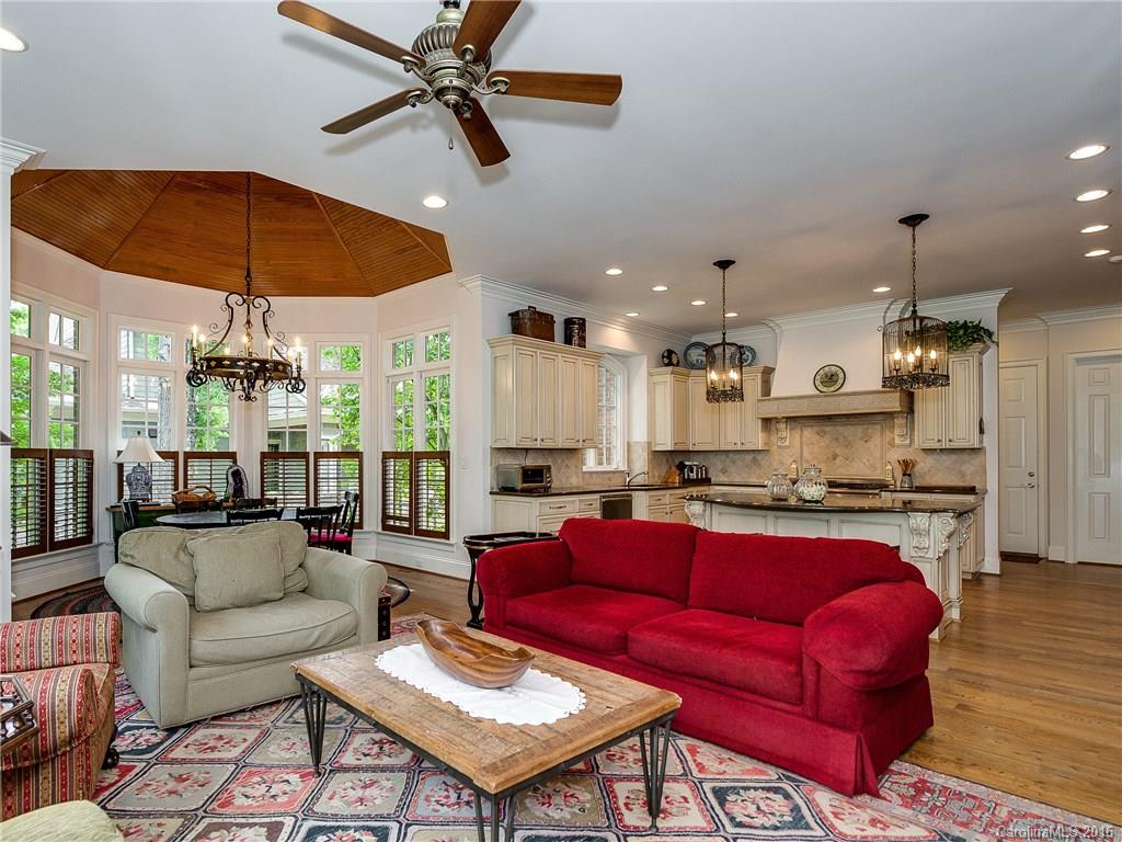2419 Overhill Road Charlotte, NC 28211 - Photo 7 of 24 a living room with furniture a ceiling fan and a rug