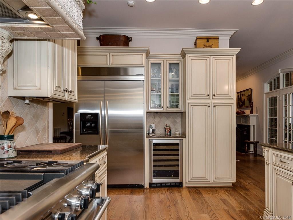 2419 Overhill Road Charlotte, NC 28211 - Photo 8 of 24 a kitchen with stainless steel appliances a refrigerator a stove and a sink