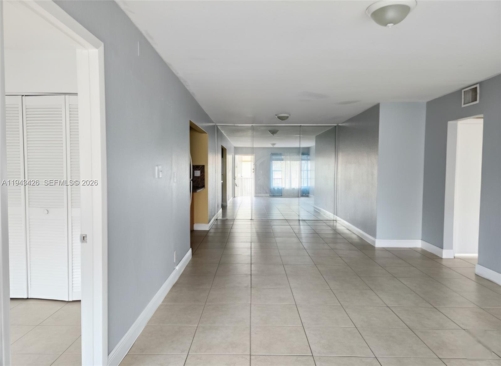 12850 Southwest 43rd Drive, Unit 250B Miami, FL 33175 - Photo 2 of 12 a view of livingroom with an entryway