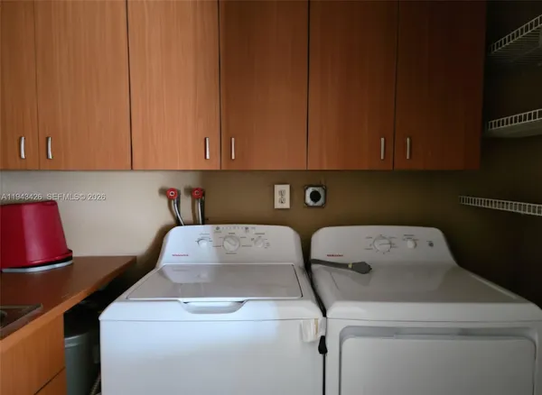 a utility room with dryer and washer