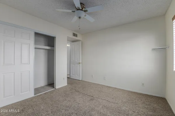 a front view of a house with a yard table and chairs