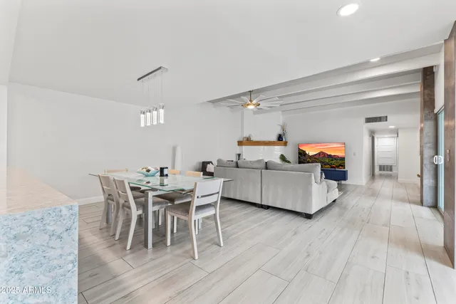 a dining room with furniture and wooden floor
