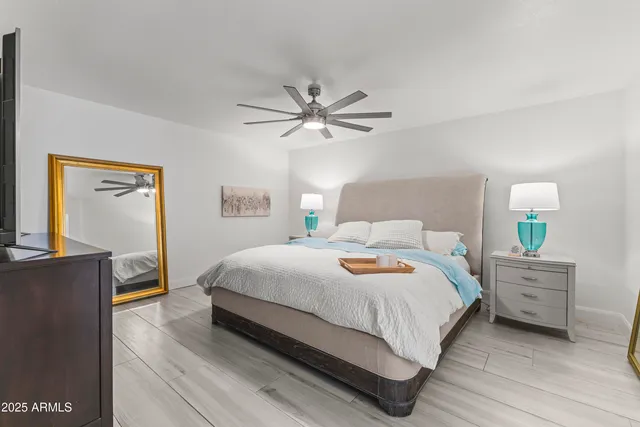 a bedroom with a bed and window