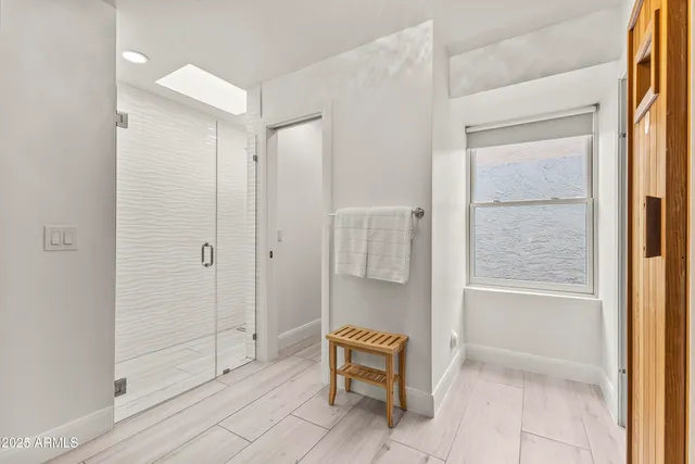 a bathroom with a tub and shower