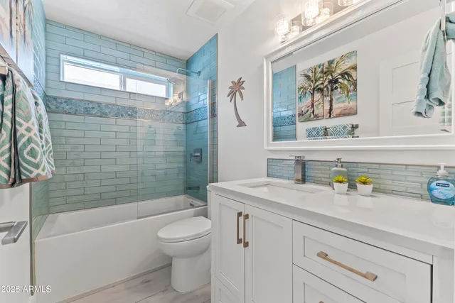 a bathroom with a sink a toilet and a bathtub