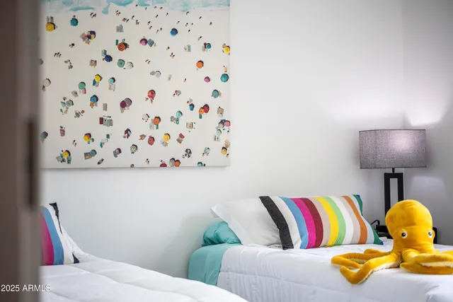 a living room with a couch and a lamp