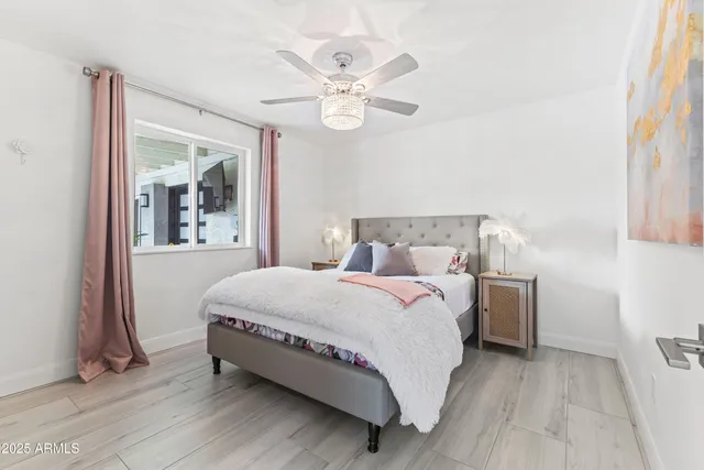 a bedroom with a bed and window