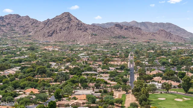 an aerial view of residential house and sandy dunes