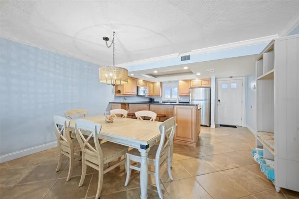 a dining room with a table and chairs
