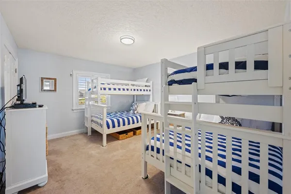 a bedroom with furniture and windows