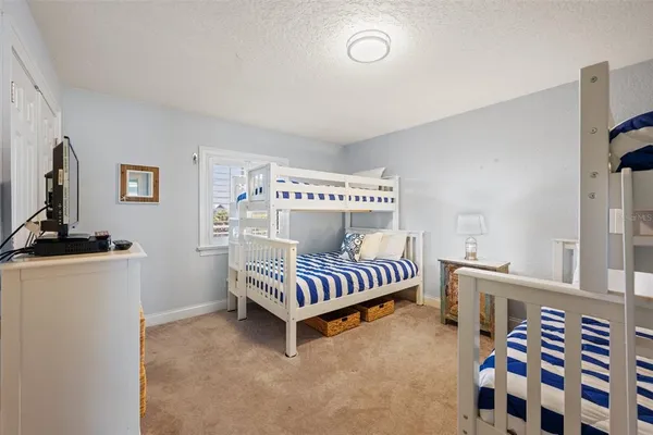 a bedroom with furniture and windows