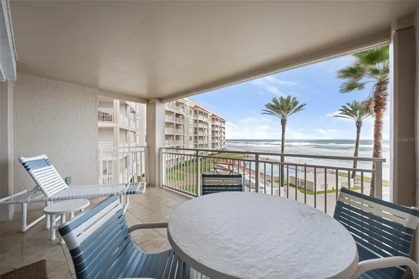 a view of a living room and dining room