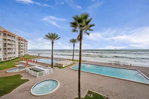 a view of a swimming pool with a lounge chair
