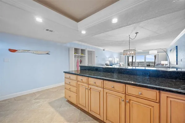 a kitchen with granite countertop white cabinets and a granite counter tops