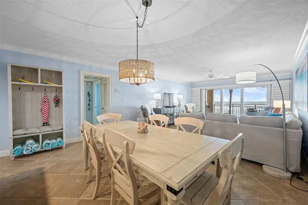 a very nice looking dining room with a table and chairs
