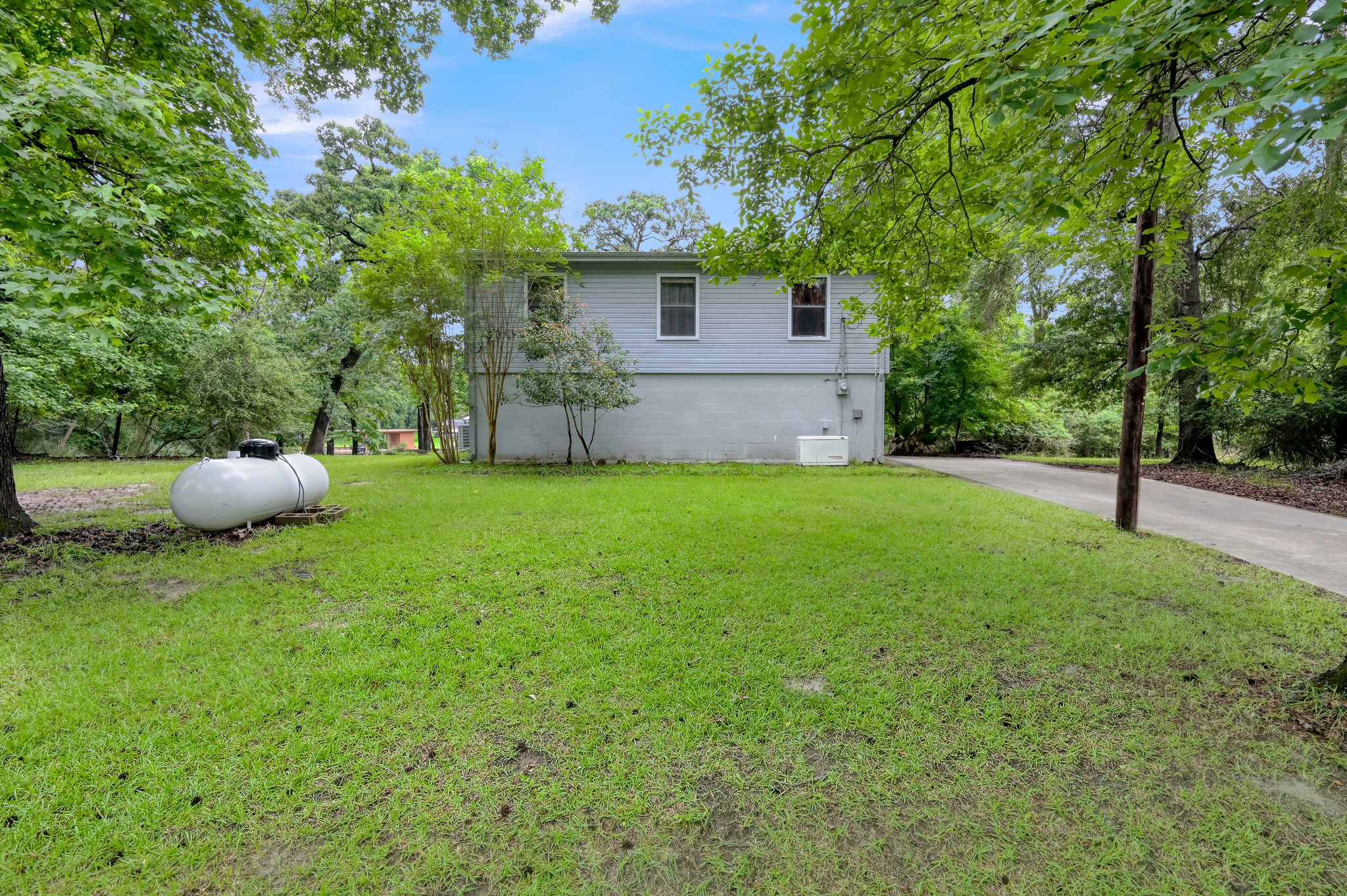 254 Sharp Lane Trinity, TX 75862 - Photo 35 of 36 a view of a backyard with a garden and entertaining space