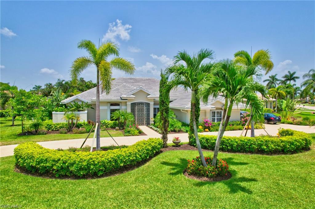 a view of a palm trees in front of a house