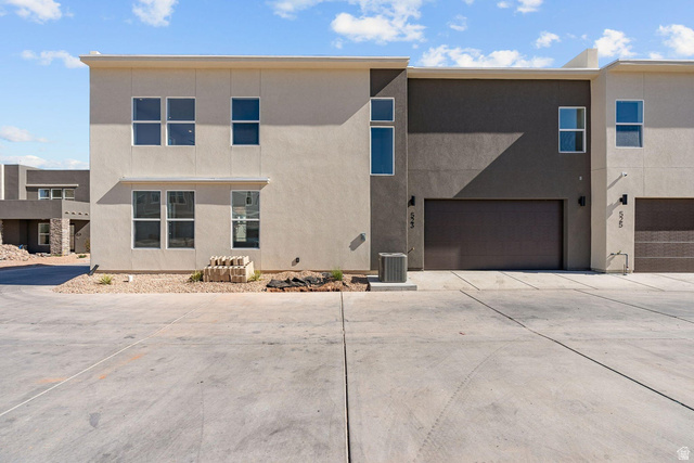 523 West Olive Lane St. George, UT 84790 - Photo 36 of 47 View of front facade featuring driveway, stucco siding, and an attached garage