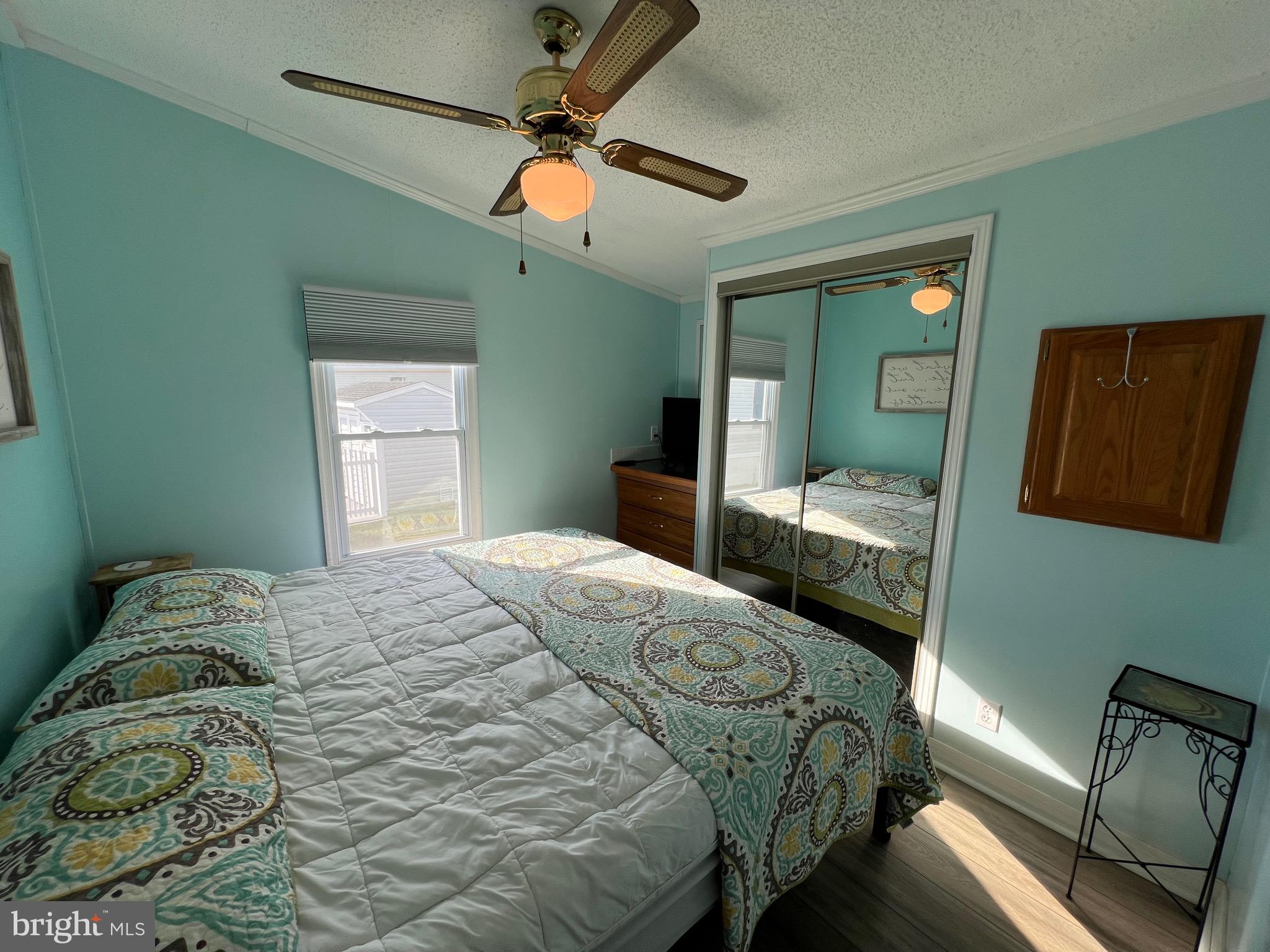 12020 Assateague Way Berlin, MD 21811 - Photo 11 of 110 a bedroom with a bed and furniture
