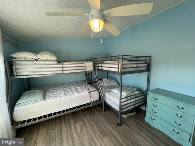 a view of swimming pool with outdoor seating and yard in back
