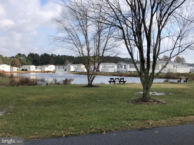 a view of a lake with outdoor seating