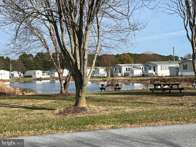 a view of a terrace with furniture and city view