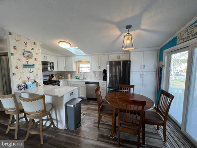 a bedroom with a bed and a mirror