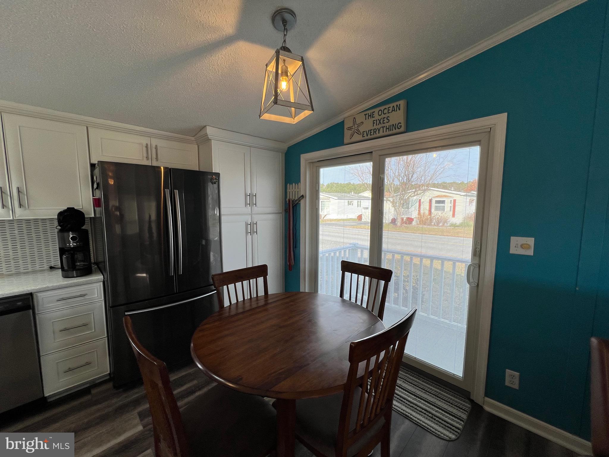 12020 Assateague Way Berlin, MD 21811 - Photo 10 of 110 a view of a dining room with furniture window and wooden floor