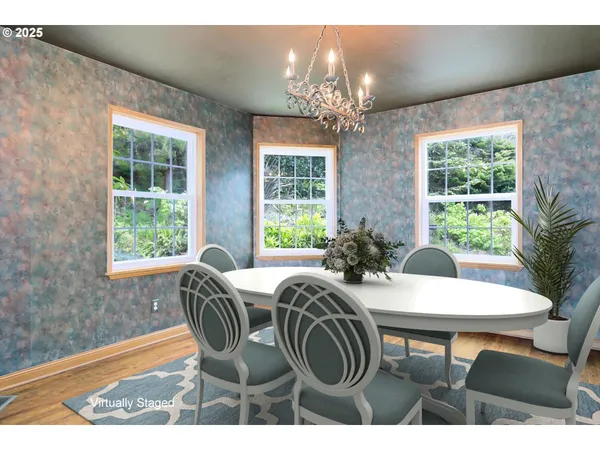 a view of a dining room with furniture window and outside view