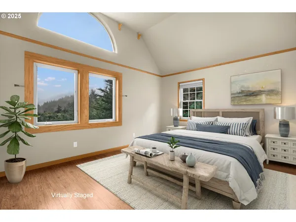 a living room with a bed furniture and a window