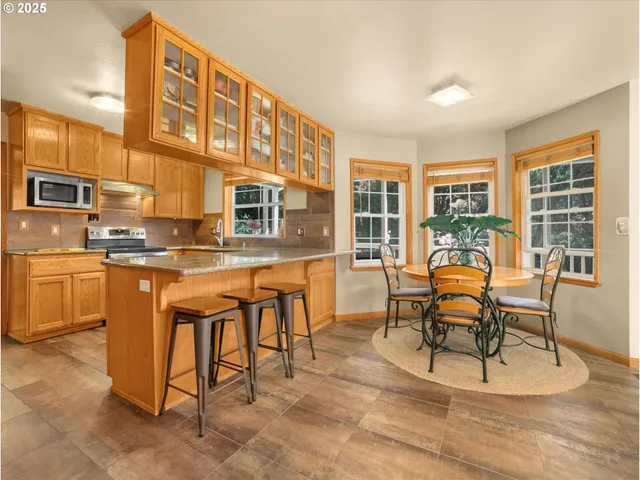 a patio with a table and chairs
