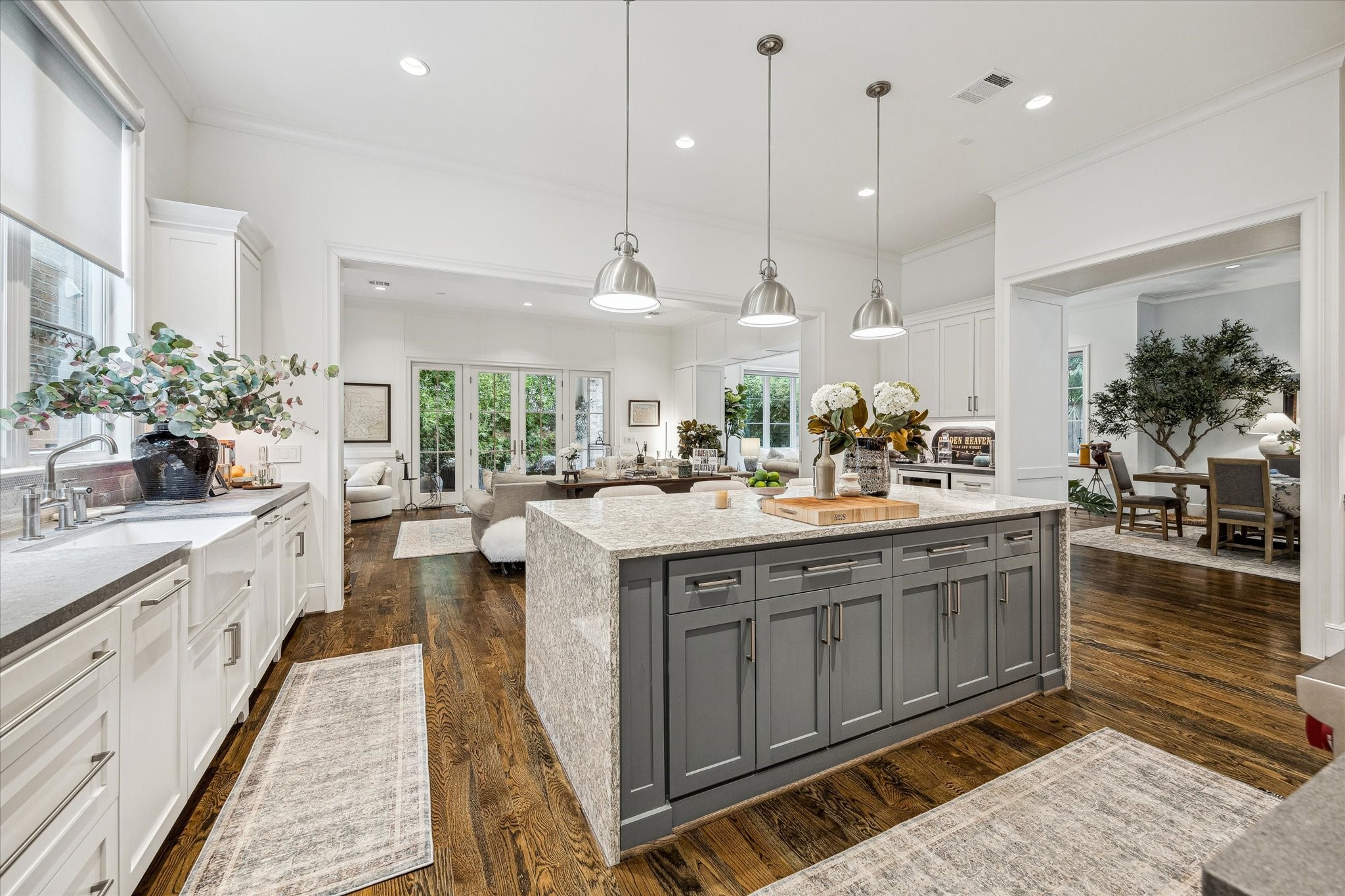 2501 Yupon Street Houston, TX 77006 - Photo 13 of 48 a kitchen with kitchen island granite countertop a large center island and a sink