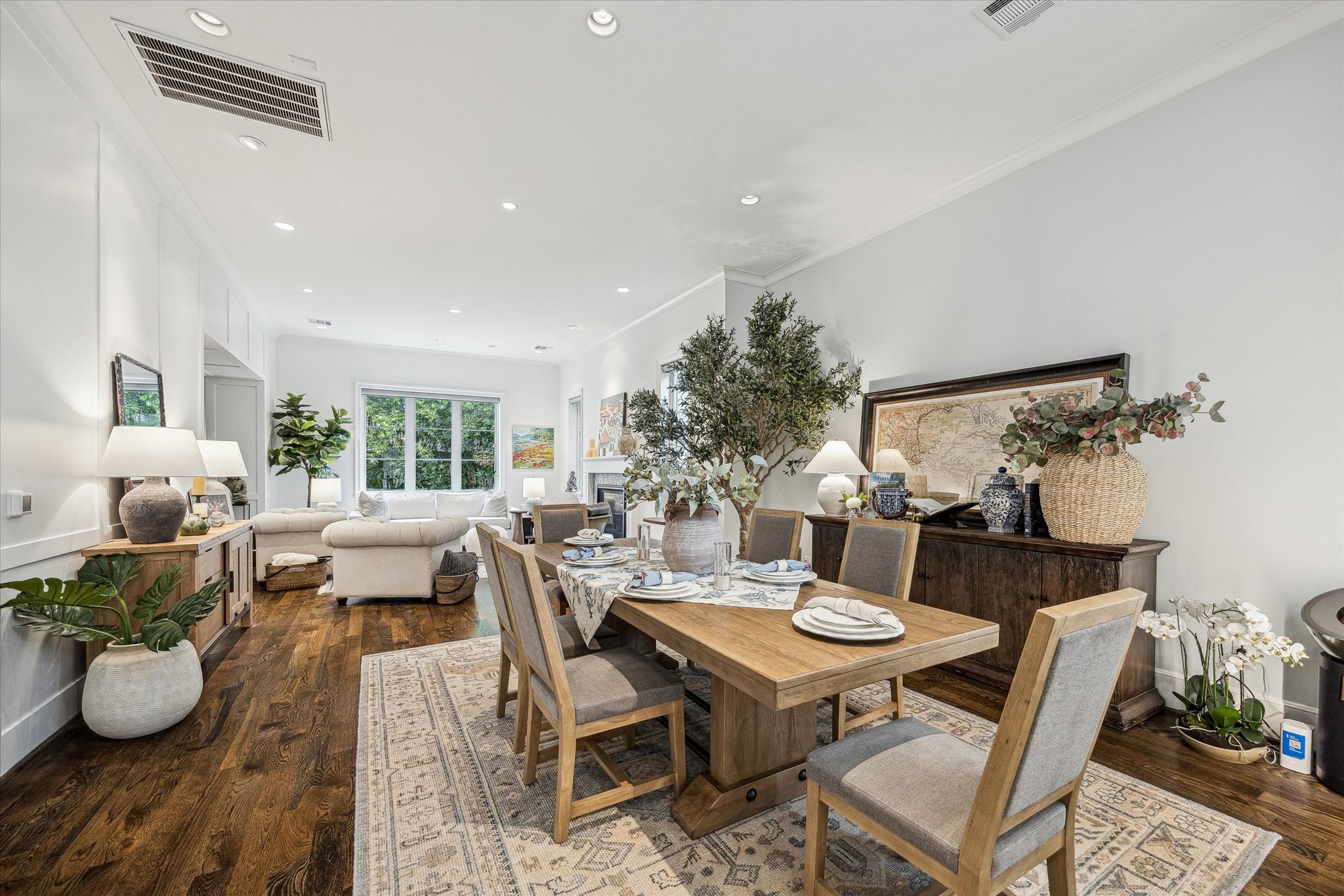 2501 Yupon Street Houston, TX 77006 - Photo 15 of 48 a view of a dining room with furniture and wooden floor