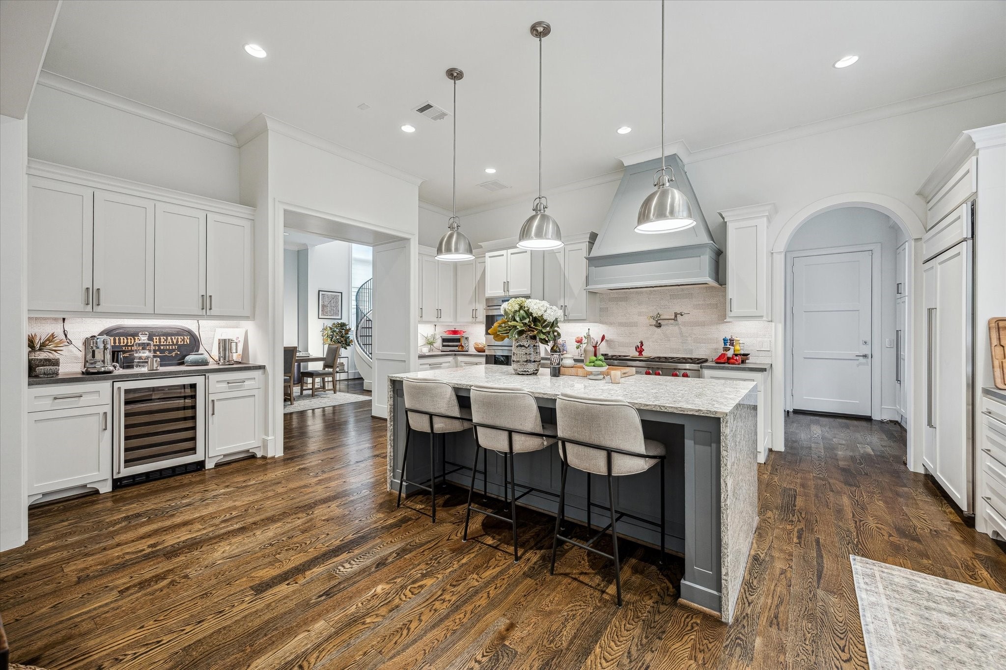 2501 Yupon Street Houston, TX 77006 - Photo 2 of 48 a kitchen with stainless steel appliances granite countertop a stove a sink dishwasher and a dining table with wooden floor
