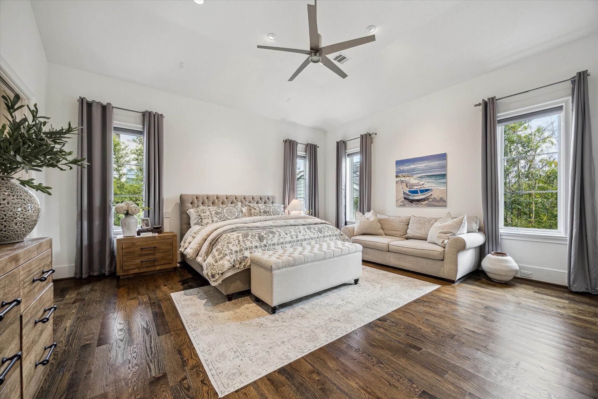 2501 Yupon Street Houston, TX 77006 - Photo 24 of 48 a bedroom with a bed couch and windows