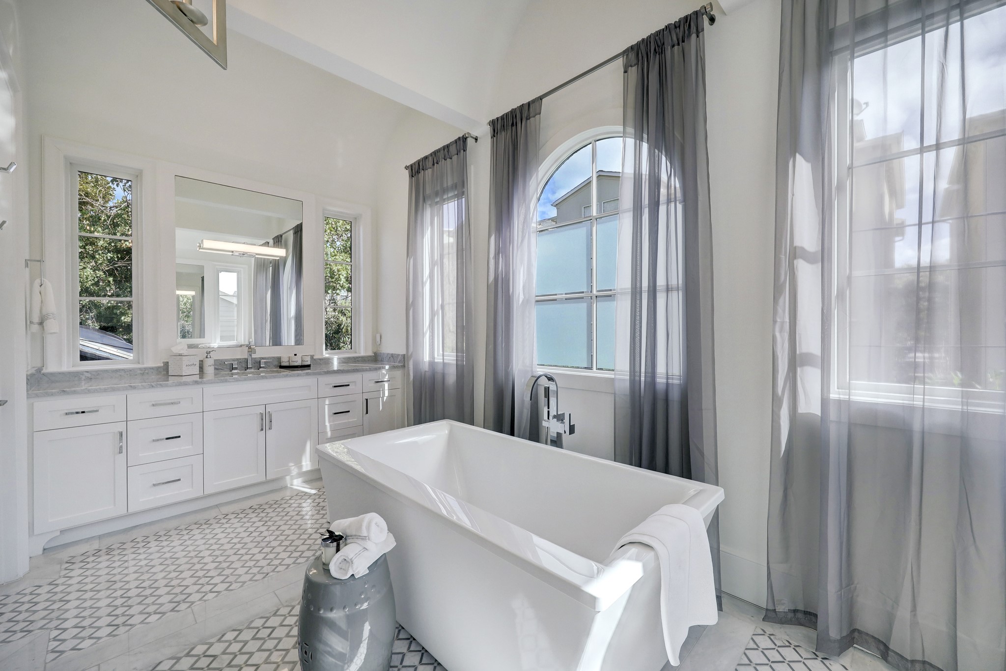 2501 Yupon Street Houston, TX 77006 - Photo 31 of 48 a large white bathroom with a granite countertop sink mirror and a shower