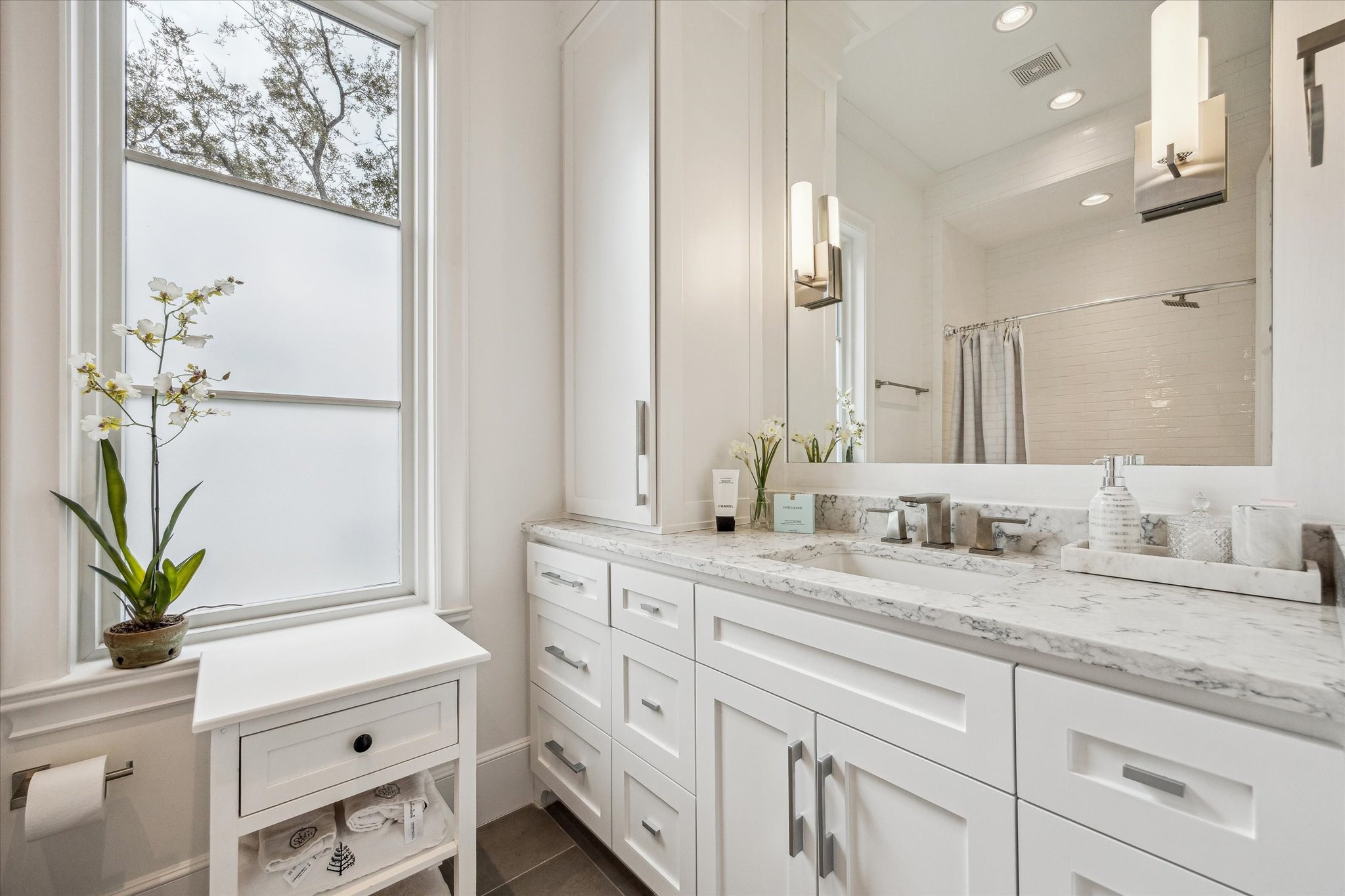 2501 Yupon Street Houston, TX 77006 - Photo 37 of 48 a bathroom with a double vanity sink and a mirror