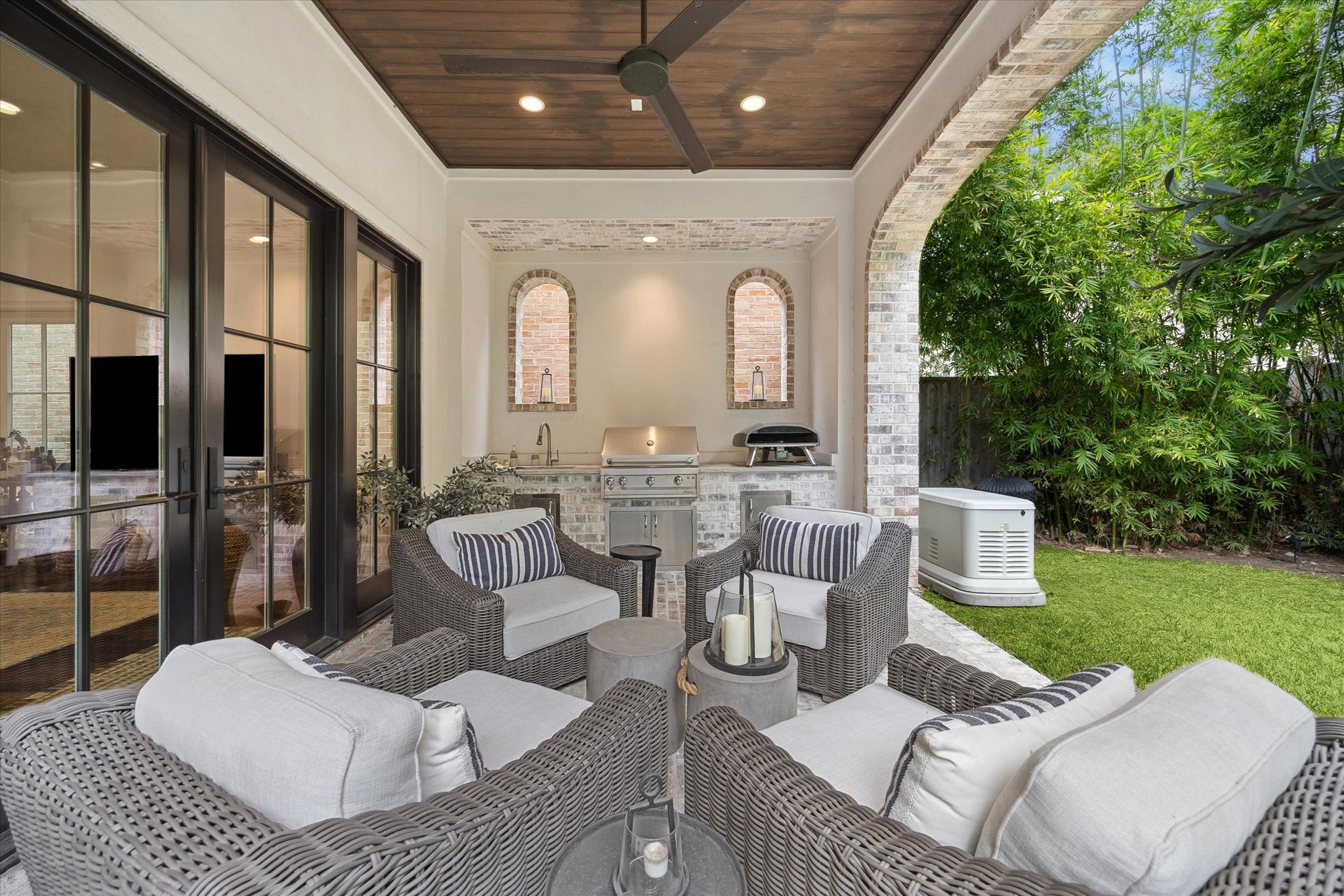 2501 Yupon Street Houston, TX 77006 - Photo 39 of 48 a view of a patio with couches chairs and potted plants