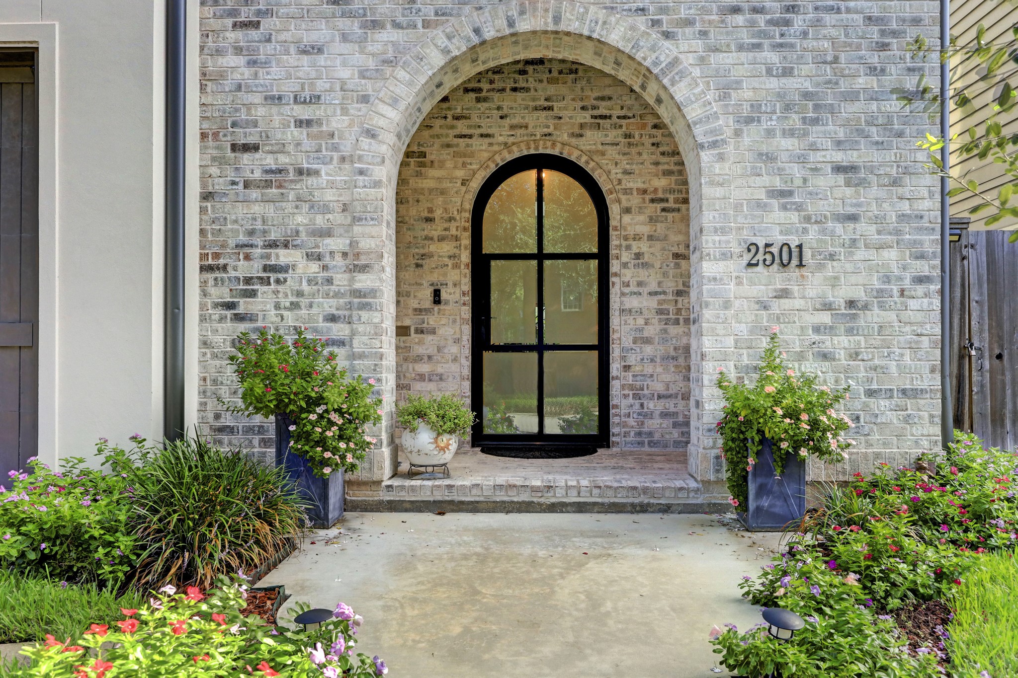 2501 Yupon Street Houston, TX 77006 - Photo 7 of 48 a couple of potted plants in front of a door