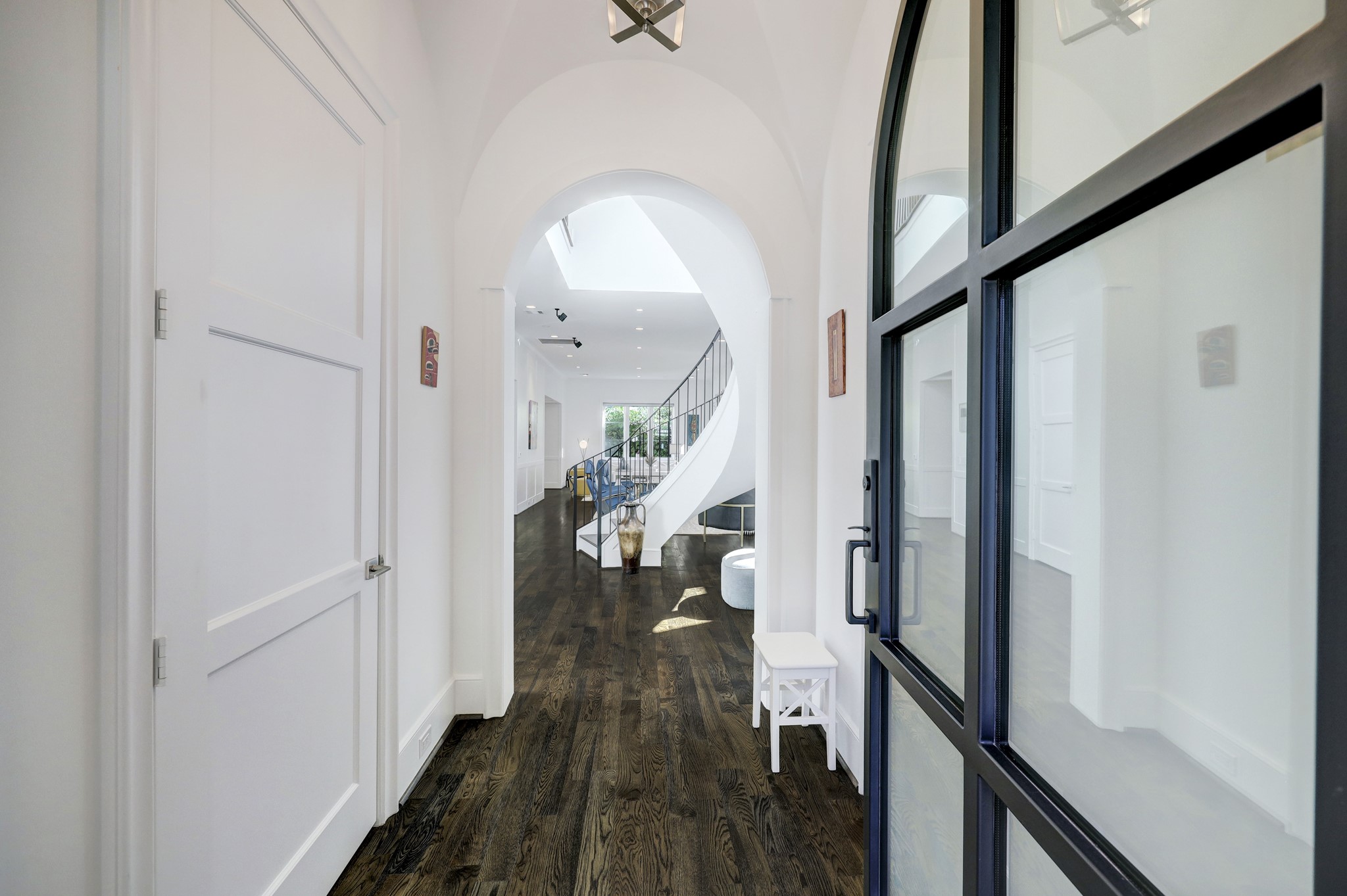 2501 Yupon Street Houston, TX 77006 - Photo 9 of 48 a view of a hallway with wooden floor and staircase