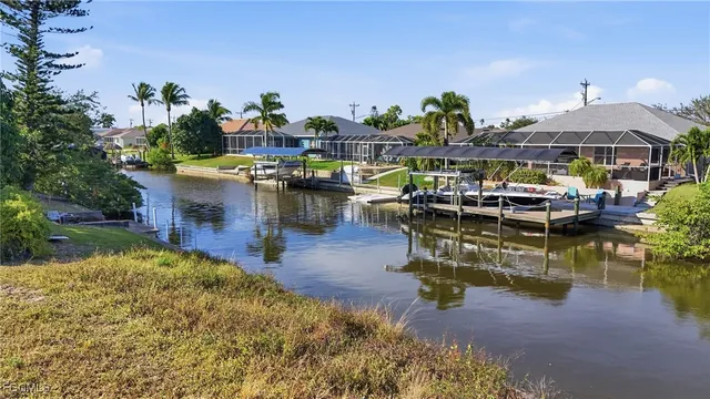 a swimming pool view with a seating space