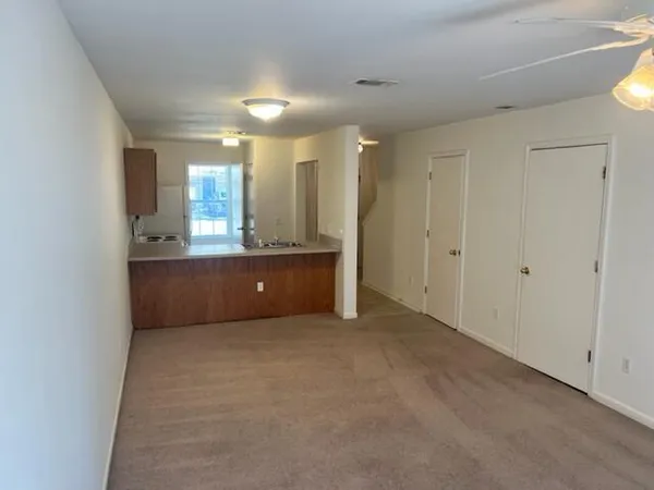 a view of an empty room with a window