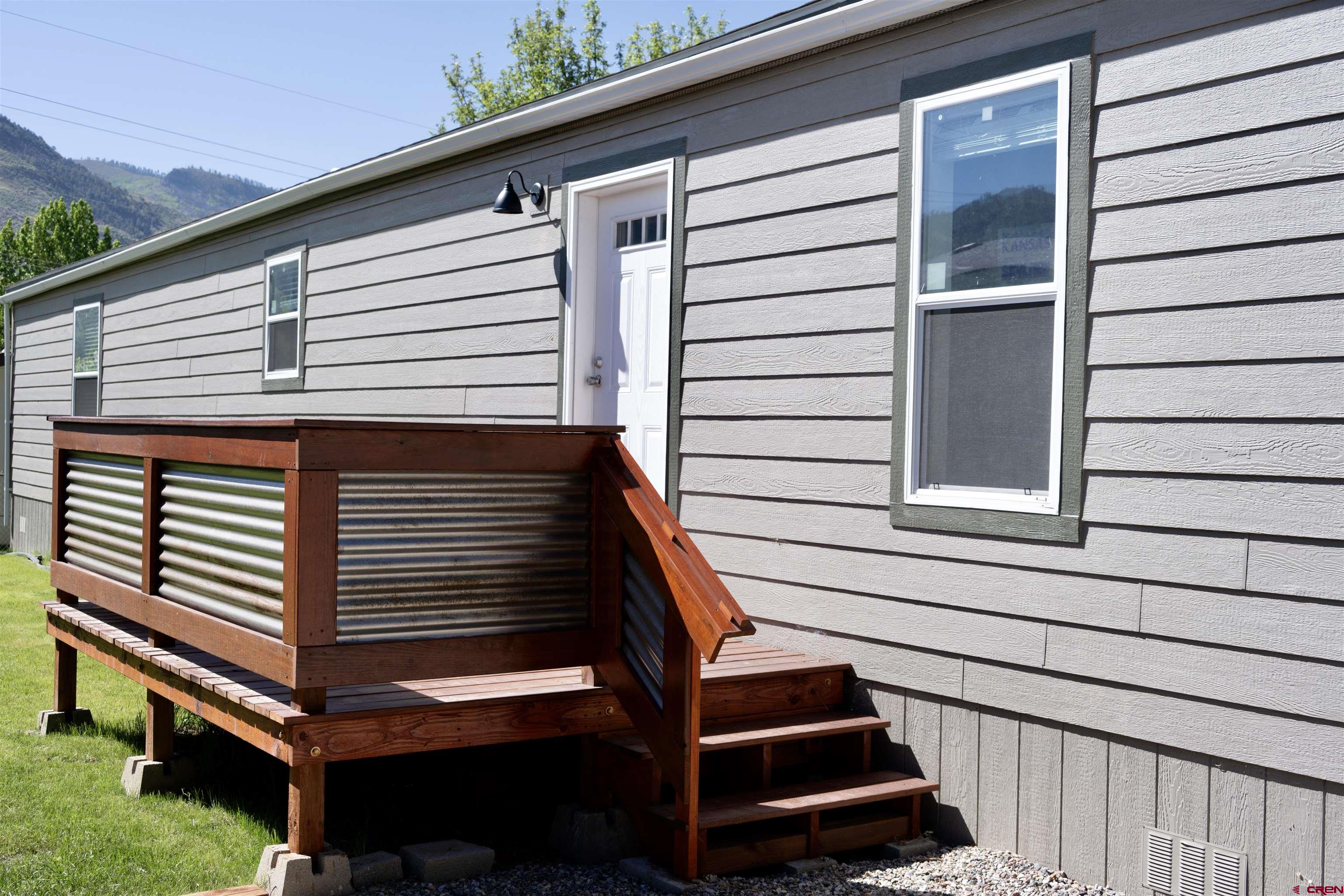 a view of entryway with wooden floor